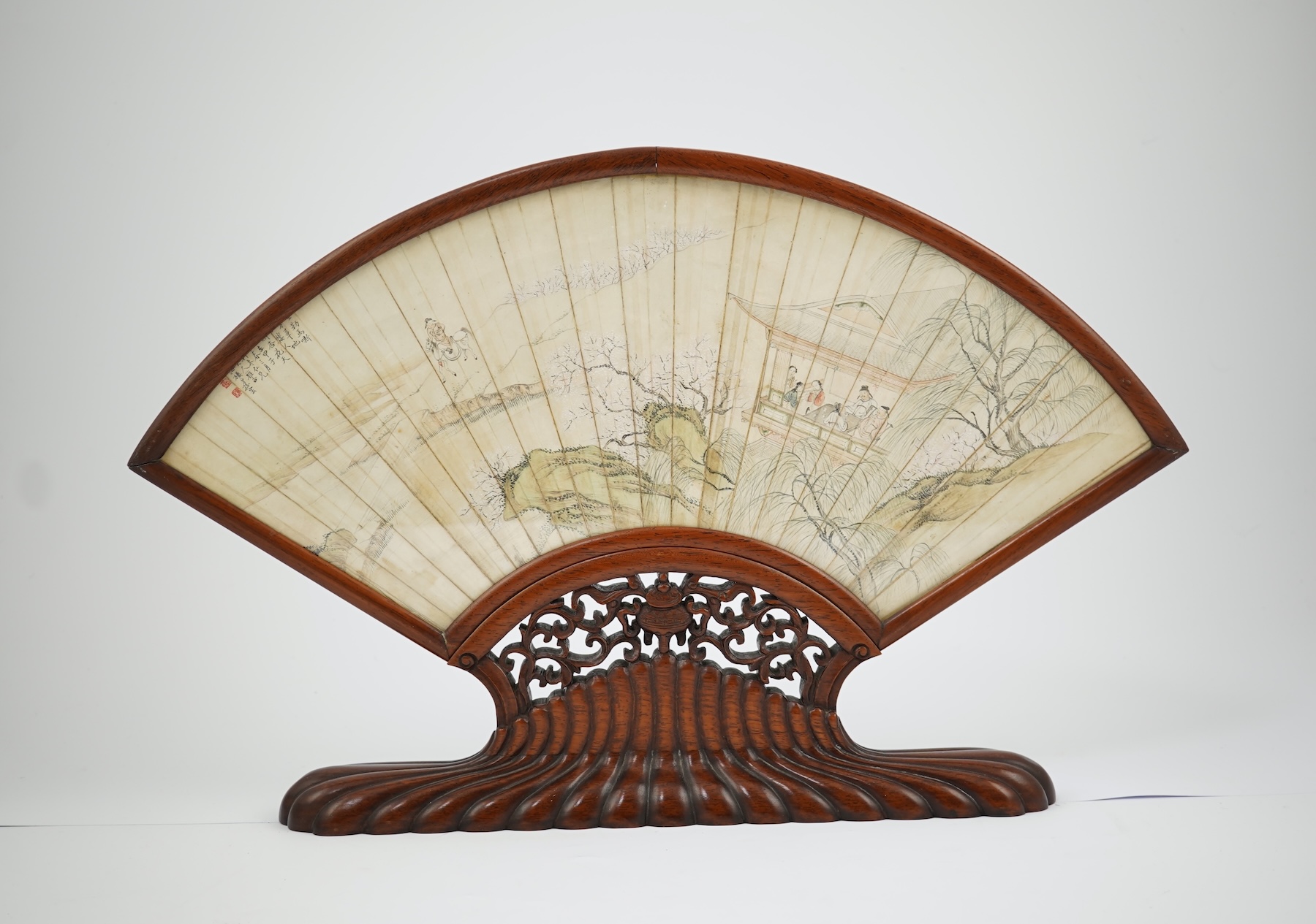A Chinese painted leaf fan and hardwood stand, late 19th century